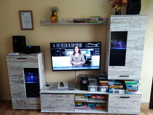 a tv sitting on top of a entertainment center at Ferienwohnung Rita in Freudenstadt