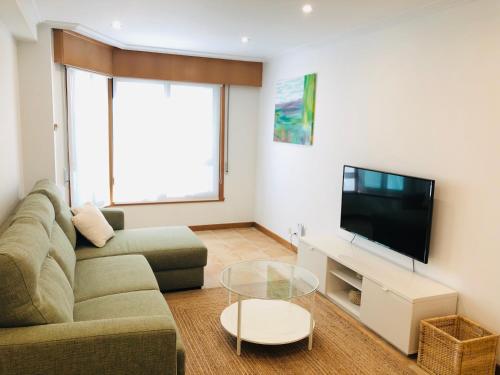 A television and/or entertainment centre at Apartamento Único