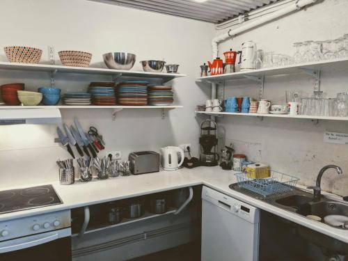 a kitchen with a sink and a counter top at Sjávarborg in Stykkishólmur