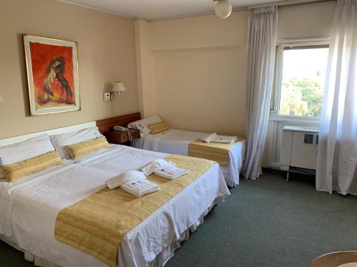 Säng eller sängar i ett rum på Hotel Sussex