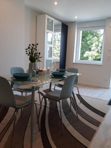 a dining room with a table and chairs at Ferienwohnung Villa Josephine in Badenweiler