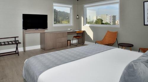 מיטה או מיטות בחדר ב-Radisson Hotel Curico