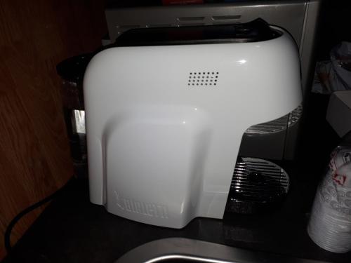 a computer printer sitting on top of a desk at B&B RELAX in Messina