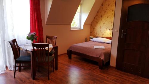 Uma cama ou camas num quarto em Villa Gracja