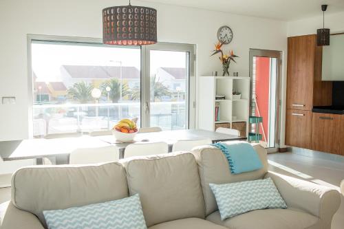 a living room with a couch and a table at RestlessWave in Peniche