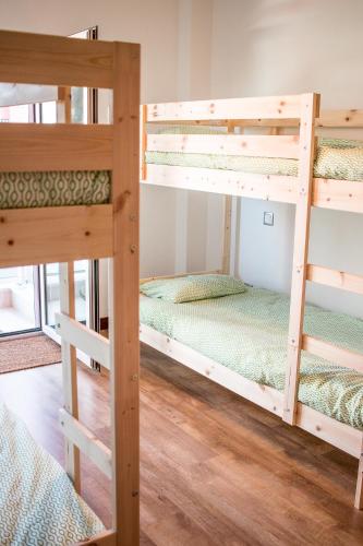 a bunk bed room with two bunk beds at RestlessWave in Peniche
