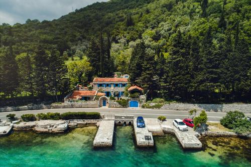 an aerial view of a house with a pool of water at Villa Old Mill in Herceg-Novi