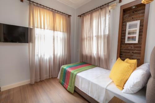 Postelja oz. postelje v sobi nastanitve Mono Hotel