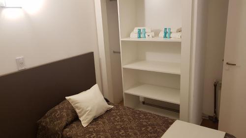 Una cama o camas en una habitación de Bagu Playa Grande Hotel