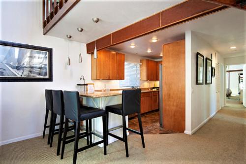 a kitchen with a table and chairs in a room at Luv Oceanside-1 House to Beach in San Diego