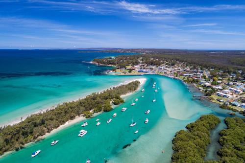 an aerial view of a beach with boats in the water at Jervis Bay Motel in Huskisson