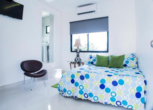 Postel nebo postele na pokoji v ubytování Malecon Rooms y Hotel