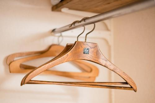 a pair of hangers hanging from a pole at Bunkyo-ku Hakusan House in Tokyo