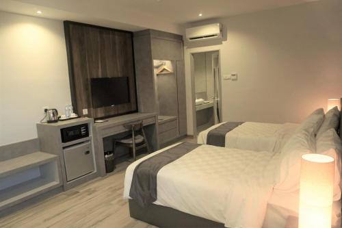 Cama o camas de una habitación en Frame Hotel