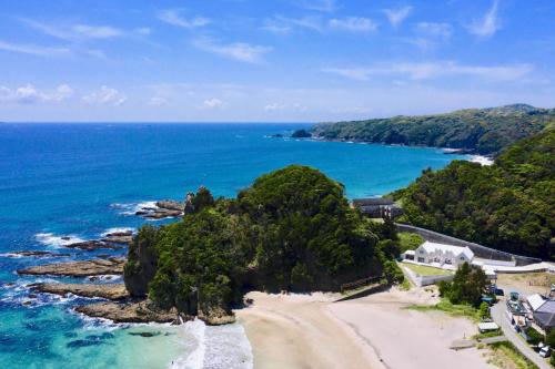 an aerial view of a beach and the ocean at Aquaholic Iritahama in Shimoda