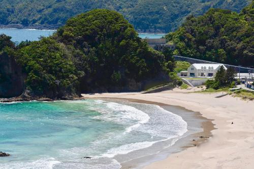 a view of a beach next to the ocean at Aquaholic Iritahama in Shimoda