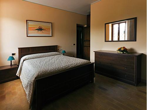 En eller flere senge i et værelse på B&B Colle San Francesco