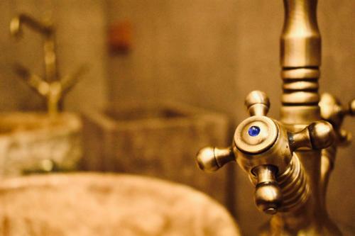 a close up of a bathroom sink with a faucet at HemDem Alçıtepe in Canakkale