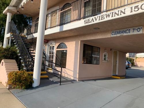 a building with a sign on the side of it at Seaview Inn Grover Beach in Grover Beach