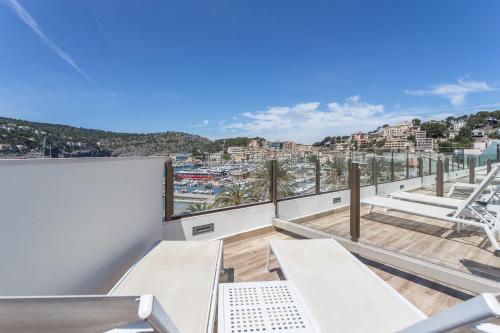 a balcony with a view of a city at FERGUS Style Soller Beach in Port de Soller