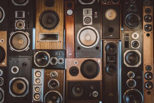 a bunch of different types of speakers on a wall at Yanbaru Hostel in Kunigami