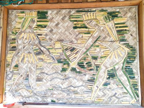 a painting of a man and a woman at Havelock Farms Resort in Havelock Island