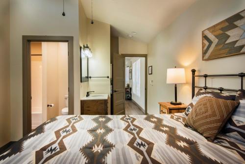 a bedroom with a bed and a bathroom at 11R Spring Meadow Retreat in Wawona