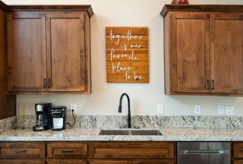 a kitchen with wooden cabinets and a sink at 11R Spring Meadow Retreat in Wawona