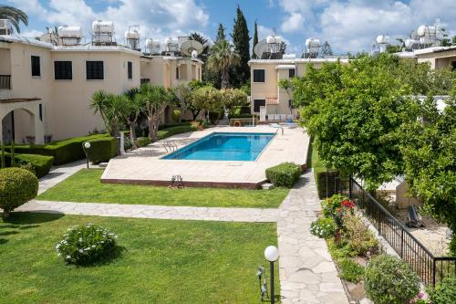 an aerial view of a house with a swimming pool at Dalia Seaside 2 Bedroom Apartment with Pool & Garden in Paphos