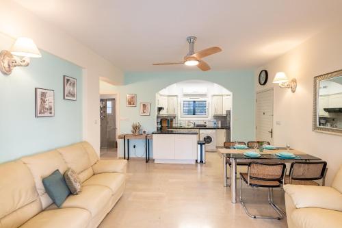 a living room with a couch and a table at Dalia Seaside 2 Bedroom Apartment with Pool & Garden in Paphos