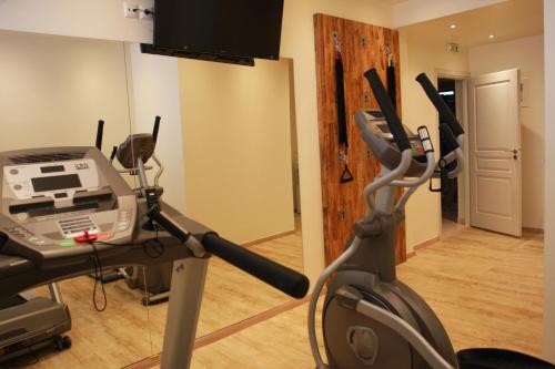 a room with a gym with a treadmill at Anastazia Luxury Suites & Spa in Athens