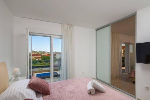Posteľ alebo postele v izbe v ubytovaní Apartment Apollo 3