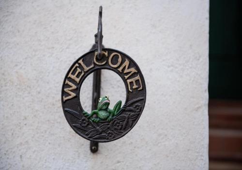 a sign that says autism hanging on a wall at La finestra sul borgo in Atrani