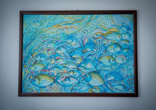 a painting of a group of fish on a wall at La finestra sul borgo in Atrani