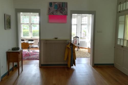 a living room with a radiator in the middle at Villa Beckmann in Gengenbach