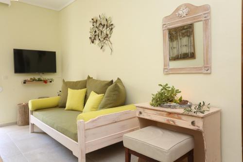 a living room with a couch and a table at Elia in Skála Foúrkas