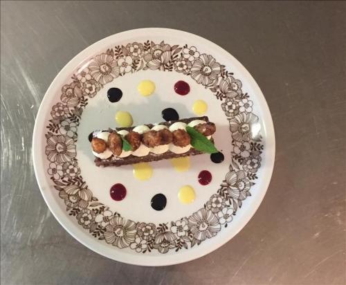 a plate of food with a face on it at Pension Volgger in Rodengo