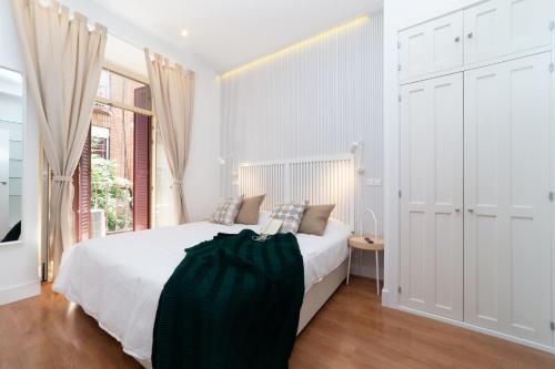 Postel nebo postele na pokoji v ubytování FUENCARRAL