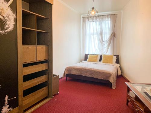a bedroom with a bed and a window at City Inn Riga Apartment, Old Town History Heritage with parking in Riga