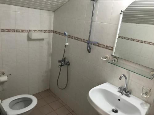 Koupelna v ubytování Calypso Cozy Suites