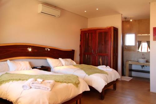 Ένα ή περισσότερα κρεβάτια σε δωμάτιο στο Cest Si Bon Hotel