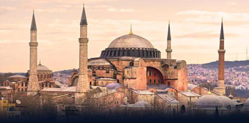 a mosque with two domes and a minaret at Viva Deluxe Hotel in Istanbul