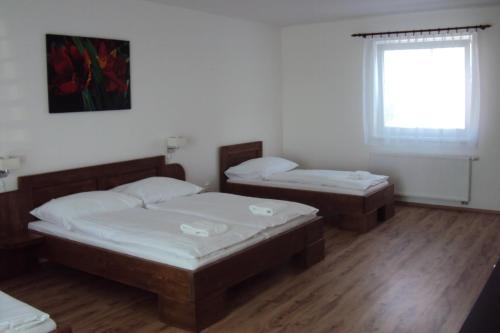 Ένα ή περισσότερα κρεβάτια σε δωμάτιο στο Motel Senec