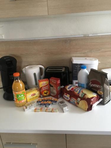 a shelf with various food items on it at Melitine in Saint-Amand-Montrond