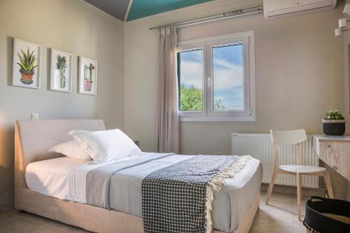 a bedroom with a bed and a window at Athinais LAK Villa in Lakithra