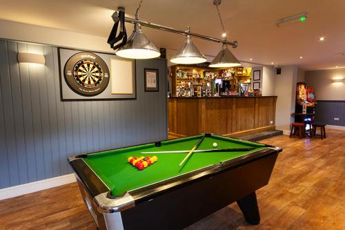 a room with a pool table and a bar at Nelthorpe Arms in Barton upon Humber