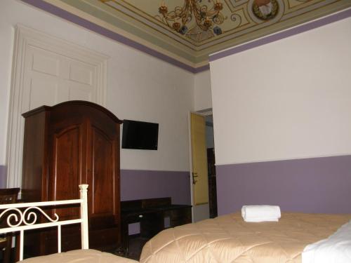 Postel nebo postele na pokoji v ubytování Il Gattopardo House