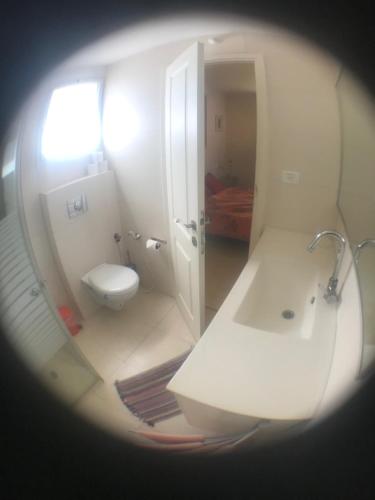 a bathroom with a sink and a toilet at Magnificant Studio/Zimmer Zichron in Zikhron Ya'akov