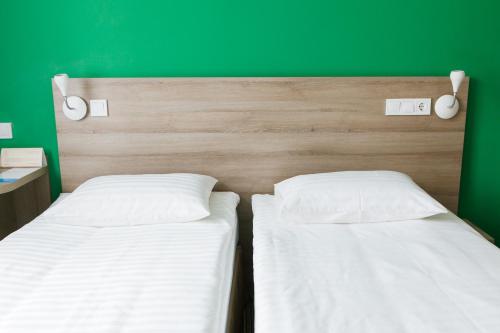 Postel nebo postele na pokoji v ubytování Raziotel Kyiv Yamska