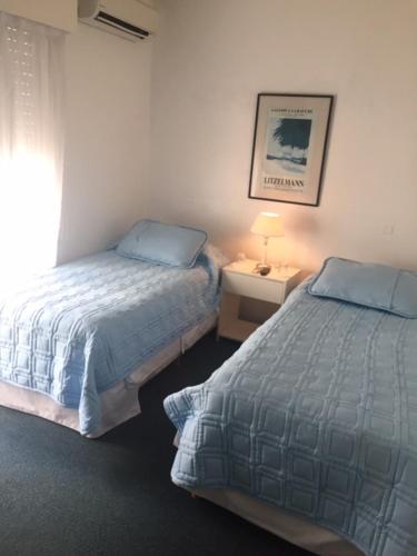 Ein Bett oder Betten in einem Zimmer der Unterkunft Aqua Hotel
